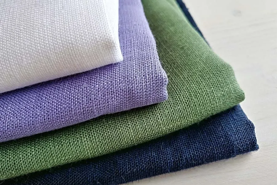 Vải cotton Hàn là gì? Ưu điểm, ứng dụng và cách chọn đúng loại 7 Cuộn vải linen cận cảnh vân sợi